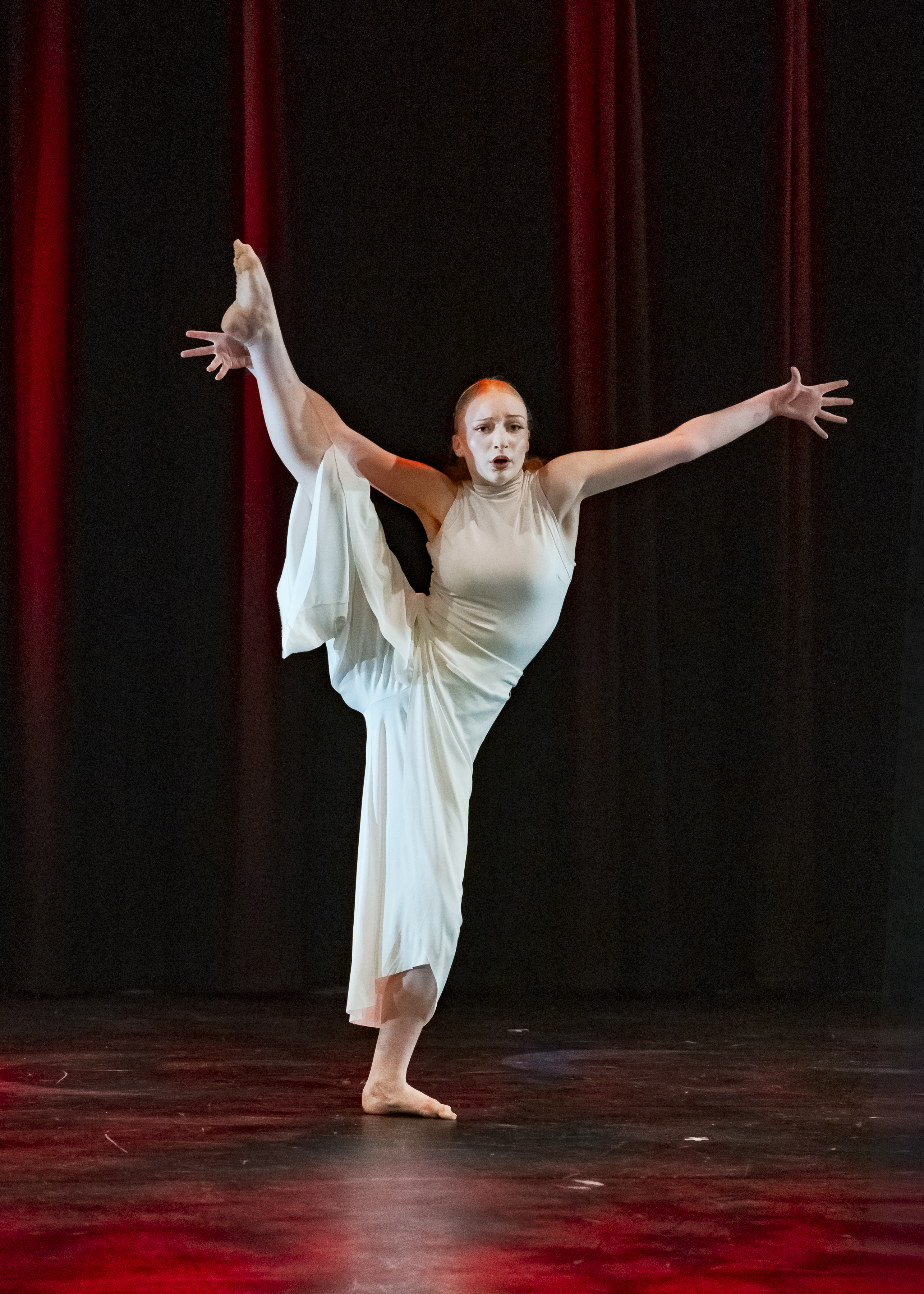 Dancer holding their right leg extended in front of them at VIREO School of Performing Arts